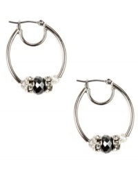 Sophisticated in silver. Nine West's darling hoop style showcases tonal plastic beads and rondelles embellished with crystal stones. Crafted in imitation rhodium-plated mixed metal. Approximate drop: 1-1/4 inches. Approximate diameter: 1 inch. Sophisticated in silver. Nine West's darling hoop style showcases tonal plastic beads and rondelles embellished with crystal stones. Crafted in imitation rhodium-plated mixed metal. Approximate drop: 1-1/4 inches. Approximate diameter: 1 inch.