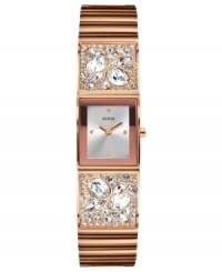 Warm glam, by GUESS. This stunning watch from GUESS flaunts a rosy bangle bejeweled with sparkling crystals. Warm glam, by GUESS. This stunning watch from GUESS flaunts a rosy bangle bejeweled with sparkling crystals.