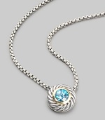 From the Color Classic Collection. A swirled sterling silver cookie pendant, with a faceted center of shimmering blue topaz, on a bold box chain. Blue topaz Sterling silver Chain length, about 16 Pendant diameter, about ½ Lobster clasp Imported