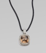 From the Moonlight Ice Collection. An enhancer of rich smokey quartz is surrounded by pavé diamonds.Diamonds, 0.45 tcw Smokey Quartz Sterling silver Enhancer width, about ½ ImportedPlease note: Chain sold separately. 