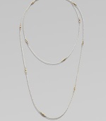A long-enough-to-double sterling silver chain, delicately spaced with clusters of tiny, faceted 14k gold beads.14k yellow gold and sterling silverLength, about 40Spring ring claspMade in USA