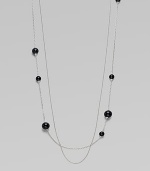 A long, delicate piece with beautiful round black agate stations on one of the two sterling silver link chains. Black agateSterling silverLength, about 39¾Clasp closureImported 