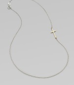 A simple, sleek cross of 14k gold sits sideways within a delicate sterling silver chain in this eloquent design.14k yellow gold and sterling silverLength, about 18Spring ring claspMade in USA