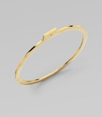 A slender golden bangle with a modern squared edge, shaped with a tab extension set with a sparkling diamond.Diamonds, .16 tcwBrassDiameter, about 3Imported