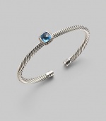 From the Noblesse Collection. Shimmering pavé diamonds frame a faceted blue topaz, delicately perched atop a cabled silver cuff. Diamonds, 0.14 tcw Blue topaz Cable, 5mm Sterling silver Diameter, about 2¼ Made in USA