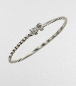 A charming, sterling silver cable design with a pretty diamond accented bow. Sterling silverDiamonds, .02 tcwDiameter, about 2½Slip-on styleImported 