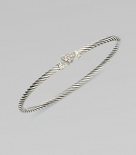 From the Cable Collectibles Collection. Thin sterling silver band with delicate diamond pavé heart.Diamond, 0.11 tcw Sterling silver Width, about 3mm Hook closure Imported 