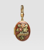 Topaz-colored CRYSTALLIZED - Swarovski Elements sparkle on this handcrafted, hand-enameled birthstone locket that opens to hold a favorite photo. Crystal Enamel 18k goldplated brass & brass-plated pewter Month indicated on the back Length, about 1¼ Width, about 1 Spring clip clasp Made in USA