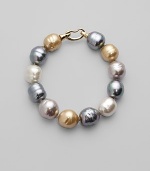 Soft shades come together in a substantial strand of lustrous baroque pearls. 14mm champagne, nuage, grey and white man-made, organic pearls 18k goldplated sterling silver spring clip clasp Length, about 8 Made in Spain