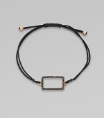 A knotted cord with a black diamond encrusted, 18K rose gold, rectangular link. Black diamonds, .28 tcw18K rose goldPolyester cordLink size, about ¾Length, about 13½ adjustableDrawstring closureImported 