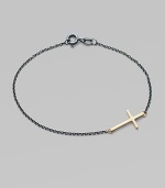 A gleaming 14k gold cross on an oxidized sterling silver chain.14k yellow gold Oxidized sterling silver Length, about 7 Pendant length, about ¾ Spring ring clasp Made in USA