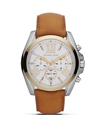 An elegant choice on duty or off. This two-tone watch from MICHAEL Michael Kors boasts a boldly sized face, roman numeral indexes and a handsome leather strap. An elegant choice on duty or off. This two-tone watch from MICHAEL Michael Kors boasts a boldly sized face, roman numeral indexes and a handsome leather strap.