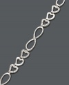 A look you'll absolutely adore! Victoria Townsend presents a fabulous, new design that highlights three, interlocking hearts and figure eight links. Crafted in sterling silver with sparkling diamond accents. Approximate length: 7 inches.