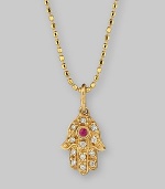 The hamsa, or open hand, a graceful symbol of protection in many cultures, becomes a shimmering necklace, set with diamonds and a single ruby, suspended from a 14k gold ball chain. Diamonds, 0.05 tcw Ruby, 0.02 ct 14k yellow gold Chain length, about 16 Pendant, about ½L x ¼W Lobster clasp Imported