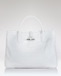 Longchamp's croc embossed leather tote exudes poise, boasting top handles and a structured silhouette. In exotic style, this bag is ready to meet daytime demands. Longchamp's croc embossed leather tote exudes poise, boasting top handles and a structured silhouette. In exotic style, this bag is ready to meet daytime demands.