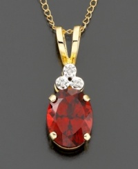An elegant look created by three diamond accents atop a rich oval-cut garnet (1-3/4 ct. t.w.). Set in 14k gold. Chain measures 18 inches; drop measures 3/4 inch. An elegant look created by three diamond accents atop a rich oval-cut garnet (1-3/4 ct. t.w.). Set in 14k gold. Chain measures 18 inches; drop measures 3/4 inch.