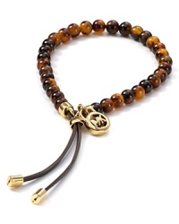 Round out your jewelry box with this bracelet from MICHAEL Michael Kors. This pieces' tortoise shell beads boldly nod to classic style while the hardware is wholly modern. Round out your jewelry box with this bracelet from MICHAEL Michael Kors. This pieces' tortoise shell beads boldly nod to classic style while the hardware is wholly modern.