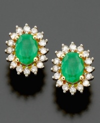 Shining stud earrings bursting with brilliance. Oval-cut emerald (1/2 ct. t.w.) and round-cut diamond (1/2 ct. t.w.) are set in 14k gold. Approximate length: 1/2 inch. Shining stud earrings bursting with brilliance. Oval-cut emerald (1/2 ct. t.w.) and round-cut diamond (1/2 ct. t.w.) are set in 14k gold. Approximate length: 1/2 inch.