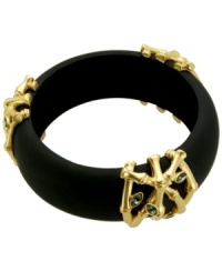 Get in touch with your inner Zen. The calming design of T Tahari's intricate bangle bracelet combines a matte black resin setting with intricate bamboo details accented by sparkling crystals and crafted in gold-plated mixed metal. Approximate diameter: 2 inches.