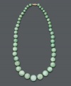 Spruce up your style in fresh, spring color. This beautiful, graduated necklace features jade beads (7-17 mm) set in 14k gold. Approximate length: 18 inches.