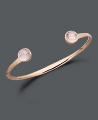 Add a girly touch with this ultimately feminine design. Studio Silver's blush tones bangle highlights round-cut rose quartz ends (4 ct. t.w.) set in 18k rose gold over sterling silver. Bracelet slips easily over the wrist. Approximate diameter: 2-1/2 inches. Add a girly touch with this ultimately feminine design. Studio Silver's blush tones bangle highlights round-cut rose quartz ends (4 ct. t.w.) set in 18k rose gold over sterling silver. Bracelet slips easily over the wrist. Approximate diameter: 2-1/2 inches.
