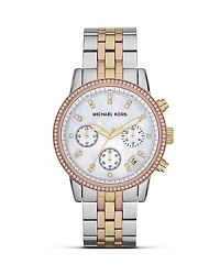 Put on the ritz with this two tone bracelet watch from MICHAEL Michael Kors. Crafted from stainless steel with a crystal-accented dial, it encapsulates high-impact accessorizing. Put on the ritz with this two tone bracelet watch from MICHAEL Michael Kors. Crafted from stainless steel with a crystal-accented dial, it encapsulates high-impact accessorizing.