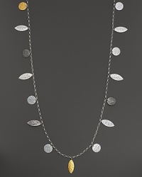 Gleaming leaves of 24K gold and black and white silver. By Gurhan. Gleaming leaves of 24K gold and black and white silver. By Gurhan.