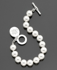 A stylish glass pearl (10 mm) toggle bracelet from Lauren by Ralph Lauren with a cute logo charm. Approximate length: 8 inches. A stylish glass pearl (10 mm) toggle bracelet from Lauren by Ralph Lauren with a cute logo charm. Approximate length: 8 inches.