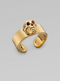 A thick adjustable band with a single prominent skull at the center. Goldtone sterling silver Width, about ¾ Made in Italy A thick adjustable band with a single prominent skull at the center. Goldtone sterling silver Width, about ¾ Made in Italy