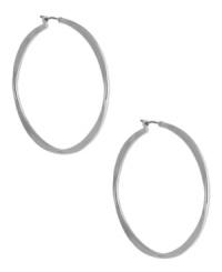 A classic hoop silhouette will never let you down. Nine West's sleek earrings finish off your everyday look. Finished with a click closure. Crafted from imitation rhodium tone mixed metal. Approximate diameter: 2 inches. A classic hoop silhouette will never let you down. Nine West's sleek earrings finish off your everyday look. Finished with a click closure. Crafted from imitation rhodium tone mixed metal. Approximate diameter: 2 inches.