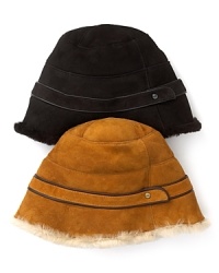 Brave city streets and country roads in UGG® Australia's super-warm, suede-and-shearling hat with a cute belt above the brim. Brave city streets and country roads in UGG® Australia's super-warm, suede-and-shearling hat with a cute belt above the brim.