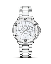 The TAG Heuer Formula 1 Ceramic and Steel collection captures racing heritage in an elegant, sporty design for today's active lifestyle. This model features a diamond accented ceramic bezel and diamond hour markers on the dial. The TAG Heuer Formula 1 Ceramic and Steel collection captures racing heritage in an elegant, sporty design for today's active lifestyle. This model features a diamond accented ceramic bezel and diamond hour markers on the dial.