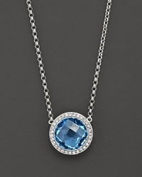 Blend some cool blues into your look. This stunning blue topaz pendant necklace features gleaming diamond accents on 14 Kt. white gold. Blend some cool blues into your look. This stunning blue topaz pendant necklace features gleaming diamond accents on 14 Kt. white gold.