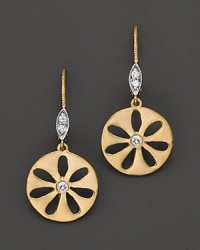 Diamonds sparkle from flower-inspired drop earrings. Diamonds sparkle from flower-inspired drop earrings.
