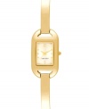Sleek minimalism for everyday style from Nine West. Crafted of gold tone mixed metal bracelet and rectangular case. Champagne dial features gold tone dot markers, numerals at twelve and six o'clock, hour and minute hands, sweeping second hand and logo at six o'clock. Quartz movement. Limited lifetime warranty.