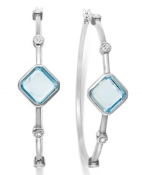 Classic earrings get a sparkly update. Victoria Townsend's stunning hoop earrings feature square-cut blue topaz (6-1/2 ct. t.w.) and sparkling diamond accents in sterling silver. Approximate diameter: 2 inches. Classic earrings get a sparkly update. Victoria Townsend's stunning hoop earrings feature square-cut blue topaz (6-1/2 ct. t.w.) and sparkling diamond accents in sterling silver. Approximate diameter: 2 inches.