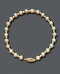 A polished pearl strand with a little extra shine. Bracelet features cultured freshwater pearls (5-1/2-6 mm) accented by shiny 14k gold beads and an ornate clasp. Approximate length: 7 inches. A polished pearl strand with a little extra shine. Bracelet features cultured freshwater pearls (5-1/2-6 mm) accented by shiny 14k gold beads and an ornate clasp. Approximate length: 7 inches.