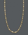 A delicate chain with subtle flair. This 14k gold necklace chain features a cylindrical and beaded dot dash design with a spring ring clasp. Approximate length: 20 inches.