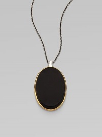 From the Saddle Collection. Sleek and dramatic, a beveled oval of matte black onyx is simply set in a frame of goldplated sterling silver, on a blackened sterling silver chain.Black onyxSterling silver and goldplated sterling silverChain length, about 16-18 (adjustable)Pendant length, about 2Lobster claspImported From the Saddle Collection. Sleek and dramatic, a beveled oval of matte black onyx is simply set in a frame of goldplated sterling silver, on a blackened sterling silver chain.Black onyxSterling silver and goldplated sterling silverChain length, about 16-18 (adjustable)Pendant length, about 2Lobster claspImported