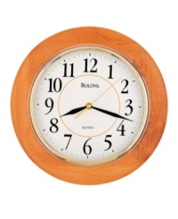 Simply classic. A timeless piece for any room, this wall clock by Bulova features a round, honey-finished wooden frame and bright gold tone bezel. White dial displays easy-to-read numerals and three hands. Simply classic. A timeless piece for any room, this wall clock by Bulova features a round, honey-finished wooden frame and bright gold tone bezel. White dial displays easy-to-read numerals and three hands.