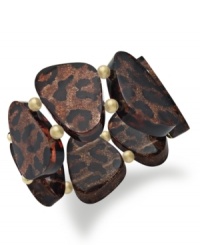Who doesn't love a little leopard? Add a dose of fabulous to your look with this gorgeous Style&co. bracelet that features glittering leopard print plastic beads and mixed metal gold tone accents. Approximate length: 7-1/2 inches. Who doesn't love a little leopard? Add a dose of fabulous to your look with this gorgeous Style&co. bracelet that features glittering leopard print plastic beads and mixed metal gold tone accents. Approximate length: 7-1/2 inches.