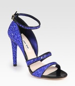 Glittered leather silhouette with smooth leather trim and an adjustable ankle strap. Glittered leather heel, 4 (100mm)Glittered leather upperLeather lining and solePadded insoleMade in ItalyOUR FIT MODEL RECOMMENDS ordering one size up as this style runs small. 