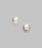 Classic, elegant stud earrings set in 18K yellow gold. 4.5mm white cultured pearls 18K yellow gold Post backs Imported 