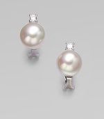 A classic design with a hint of sparkle for a truly versatile piece. 12mm round white organic man-made pearlsCubic zirconiaSterling silverSize, about ¼Post clip backImported 