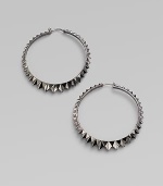 Sterling silver hoops with black rhodium accents have a faceted zigzag pattern all around. Sterling silver and black rhodium Diameter, about 2½ Pierced Imported