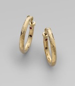 From the Martellato Collection. Soft, romantic grooves put a vintage texture to classic, 18k yellow gold hoops. 18k yellow gold Diameter, about 1 Hinge close Made in Italy 