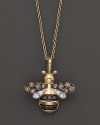 Black and brown diamonds, set in a 14K yellow gold bumblebee pendant, add sweetness to your look.