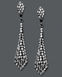 It's a black tie affair. Kaleidoscope's elegant tie-shaped drop earrings shine feature round-cut smokey crystals. Set in sterling silver with Swarovski elements. Approximate drop: 1-1/2 inches. It's a black tie affair. Kaleidoscope's elegant tie-shaped drop earrings shine feature round-cut smokey crystals. Set in sterling silver with Swarovski elements. Approximate drop: 1-1/2 inches.