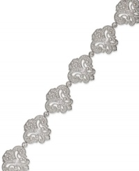 Well-rounded elegance. This Eliot Danori bracelet is decorated with rows of swooping designs embellished with round-cut crystal accents and cubic zirconias (2-3/4 ct. t.w.). Set in rhodium-plated mixed metal. Approximate length: 7-1/4 inches.