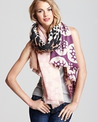 Rich pink and purple populate the bubble moon print of this stay-warm scarf from DIANE von FURSTENBERG. Rich pink and purple populate the bubble moon print of this stay-warm scarf from DIANE von FURSTENBERG.